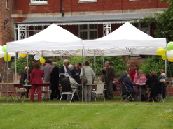 Parishioners sheltering under a gazebo